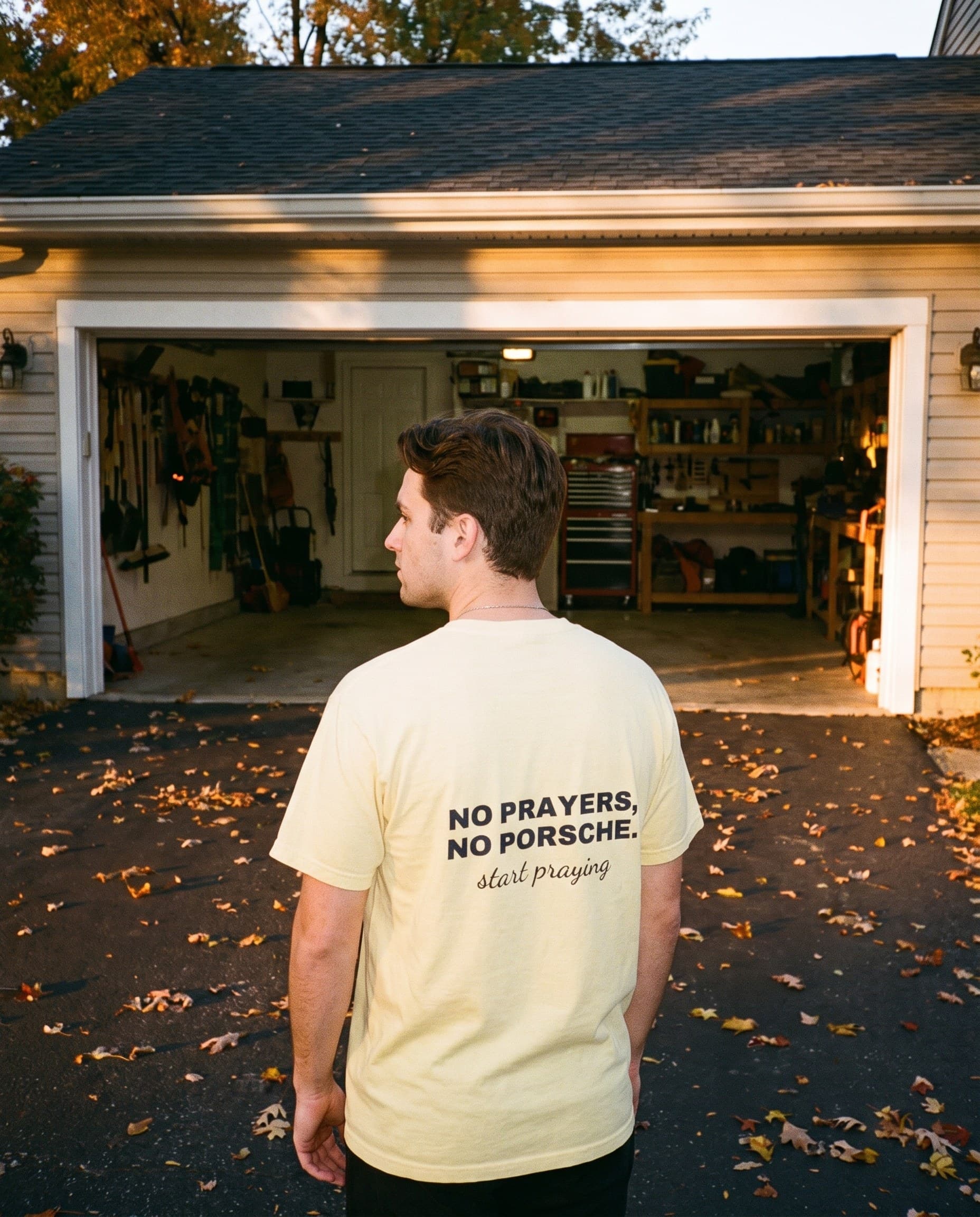 Back view of the "NO PRAYERS, NO PORSCHE. start praying" tee