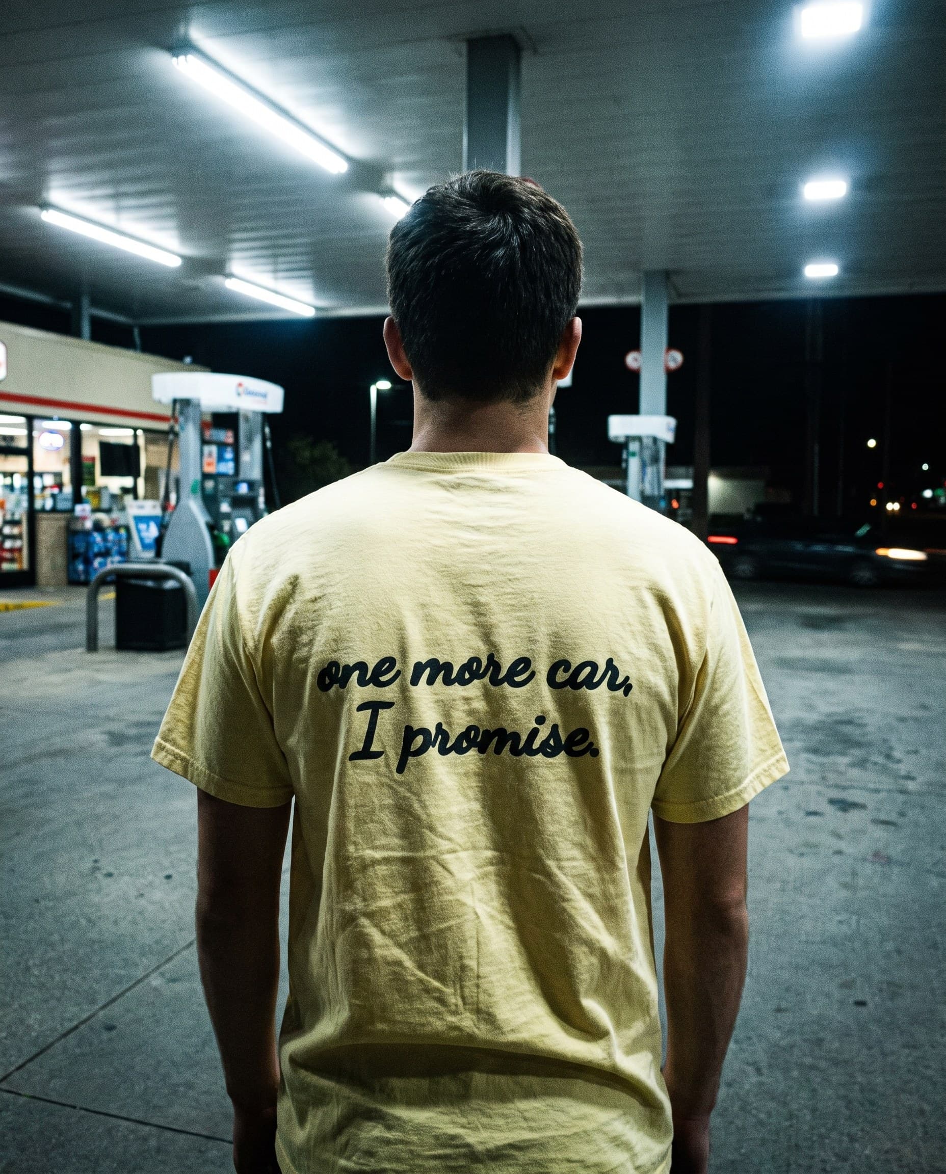 Back view of the "one more car, I promise." tee