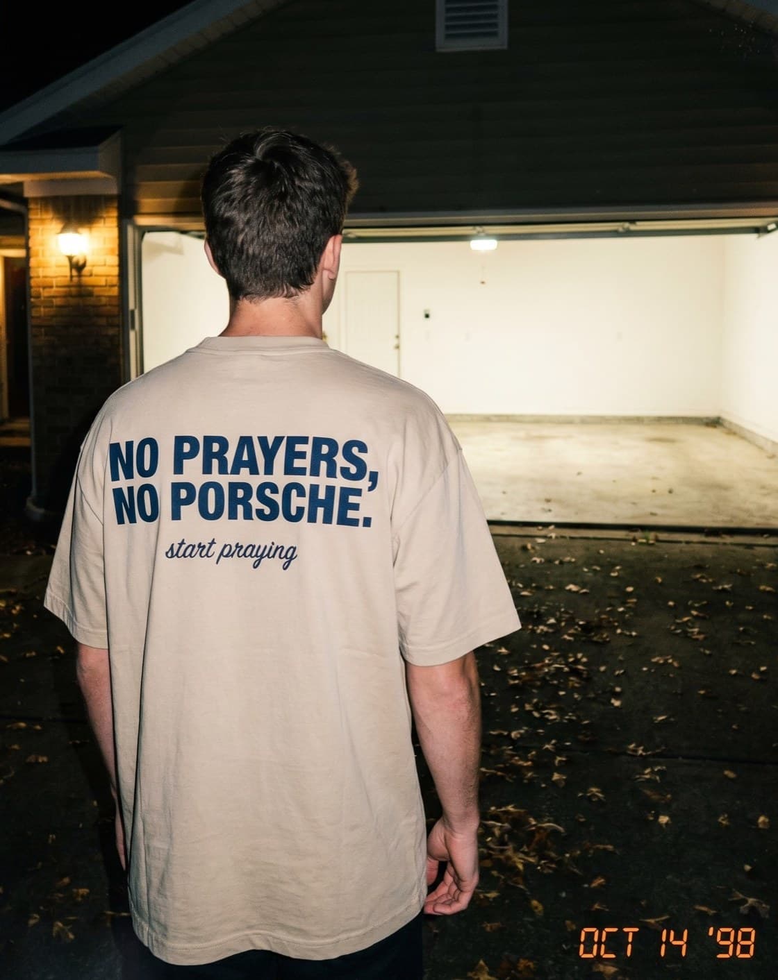Back view of the "NO PRAYERS, NO PORSCHE. start praying" tee