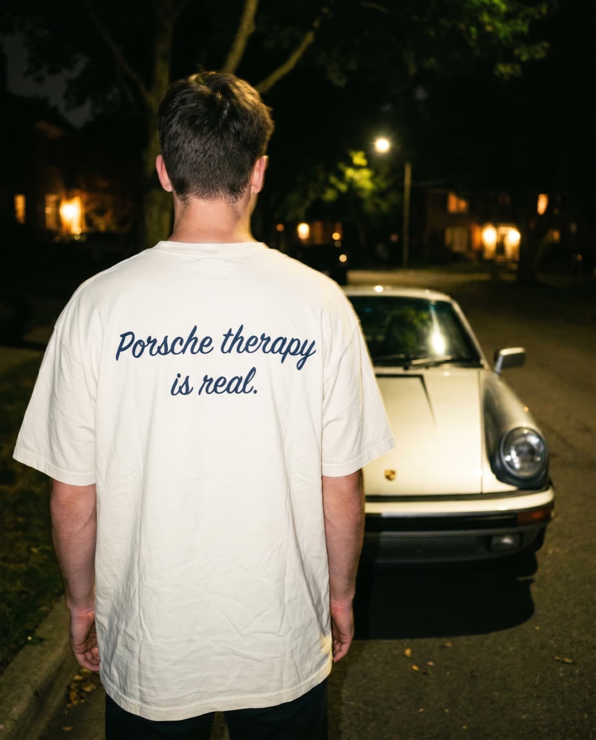 Back view of the "Porsche therapy is real." tee