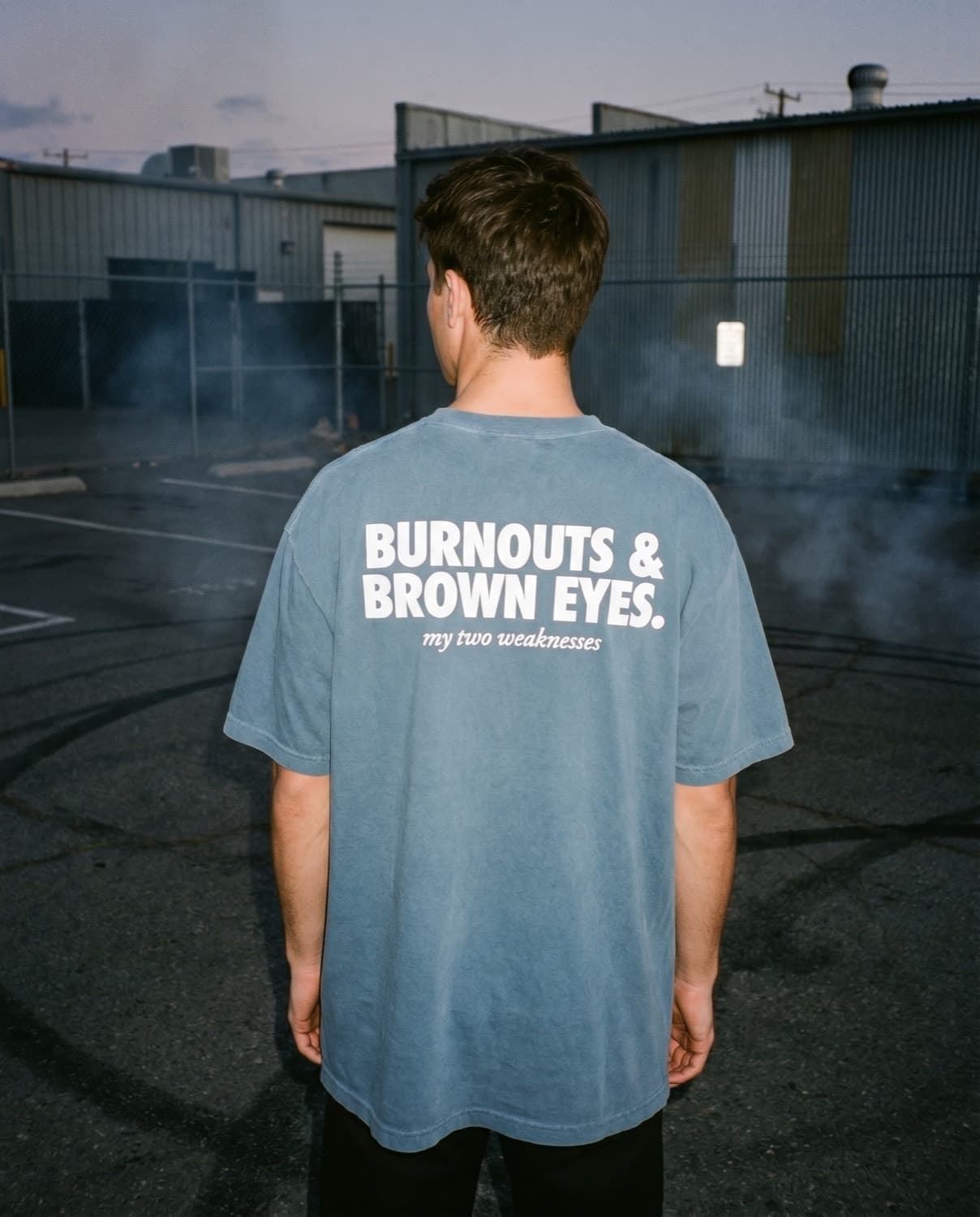 Back view of the "BURNOUTS & BROWN EYES. my two weaknesses" tee