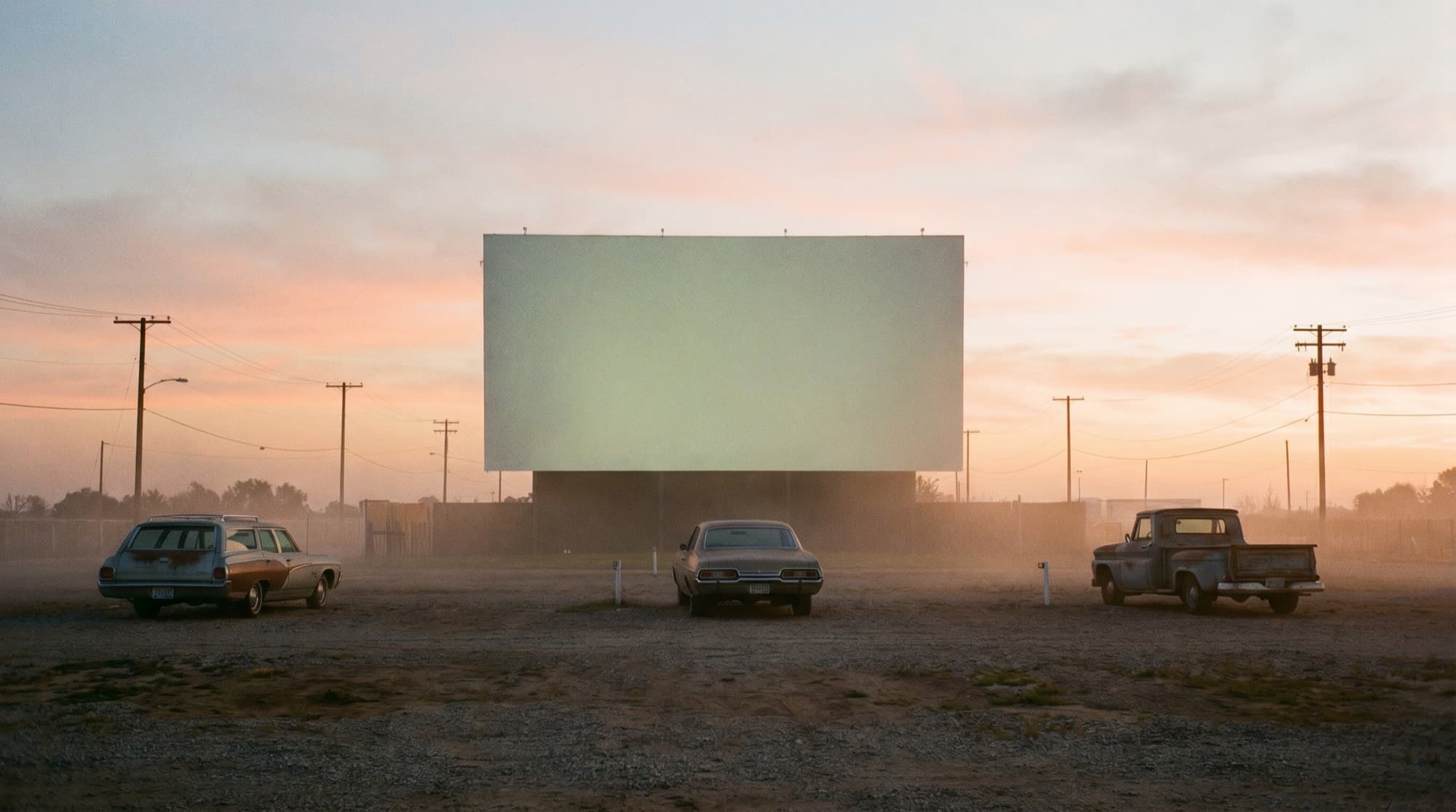 An empty drive-in theater at dusk